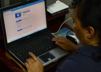 A man surfs the Internet in his home on Amargura and Mercaderes streets, one of the places chosen for the home Internet pilot test, in the neighborhood of Old Havana, in December 2016. Photo: Joaquín Hernández / Xinhua.