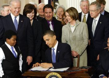 hoto taken on March 23, 2010 of then President Barack Obama signing in the White House in Washington the reform of the healthcare system. (AP Photo/J. Scott Applewhite)