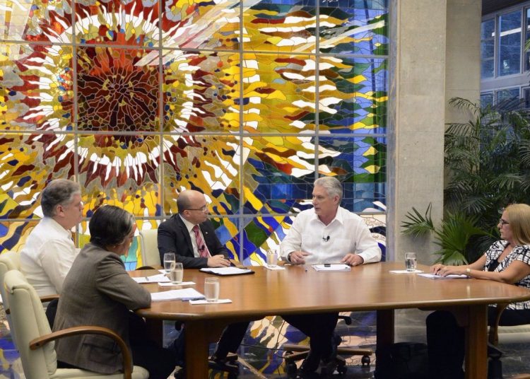 Cuban President Miguel Díaz-Canel (2-r) talks about the increase in salaries and other economic reforms in Cuba in the Mesa Redonda TV program on Tuesday, July 2, 2019. Photo: Estudios Revolución.