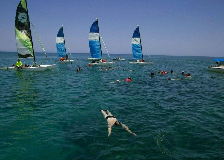 Tourists snorkeling at Varadero beach, Cuba. Photo: Ismael Francisco / AP.