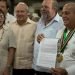 Chef Eddy Fernández (r), president of the Culinary Federation of Cuba, shows the document that accredits Cuban cuisine as national Cultural Heritage. Next to him, Cuban Minister of Tourism Manuel Marrero (second to the right) and Gladys Collazo, president of the National Cultural Heritage Council (l), among other personalities. Photo: Otmaro Rodríguez.