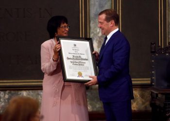 Russian Prime Minister Dmitry Medvedev (r) receiving from the rector of the University of Havana, Miriam Nicado (l), the title of Doctor Honoris Causa in Political Sciences, on Friday, October 4, 2019 in Havana. Photo: Yander Zamora / EFE.
