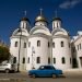A Moskvitch car from the Soviet era circulates in front of the Russian Orthodox Cathedral in Havana. Photo: Ismael Francisco / AP.