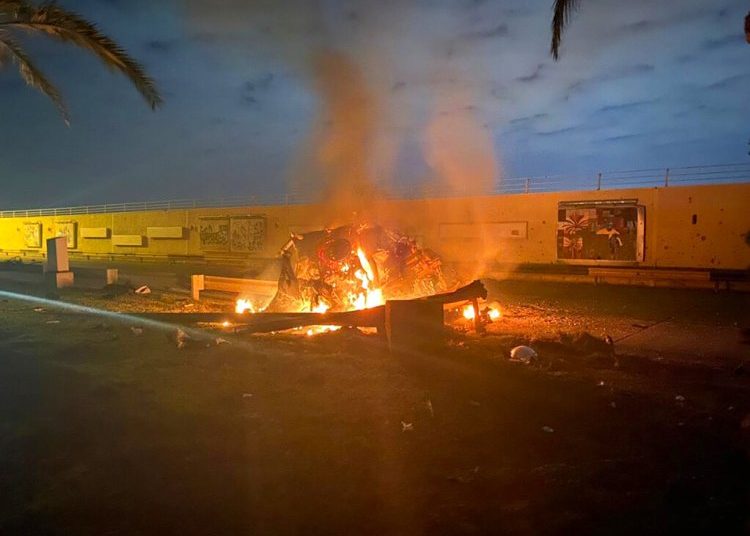 In this image, distributed by the press office of the Iraqi prime minister, a burning vehicle is shown at Baghdad International Airport after an air raid in Baghdad on January 3, 2020. Photo: First Press office of Iraqi Prime Minister via AP.