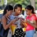 A group of women use their cell phones this Friday, in Havana. Photo: Yander Zamora / EFE.