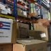 A worker inspects boxes with sanitary supplies that have arrived from China to contain the pandemic due to the new coronavirus in Cuba. Photo: Joaquín Hernández/Xinhua/Archive.