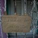 A sign saying “Closed for coronavirus COVID-19” hangs on the window of a business in Havana, Cuba, on Friday, April 24, 2020. (AP Photo/Ismael Francisco)