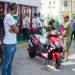 A couple by an electric motorcycle purchased at El Tángana gas station, in Havana, on October 28, 2019. Photo: Otmaro Rodríguez.