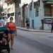 A couple walks their son in Havana. Photo: Ernesto Mastrascusa/EFE.