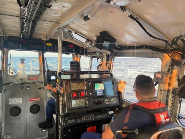 Photo courtesy of the U.S. Coast Guard, showing two of its members during the rescue of several people on May 27, approximately 16 miles (25 km) south of Key West, Florida. Photo: U.S. Coast Guard.