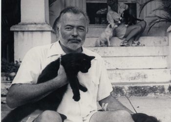 Hemingway and Mary with the cats in the doorway of their Havana house. | PBS archive