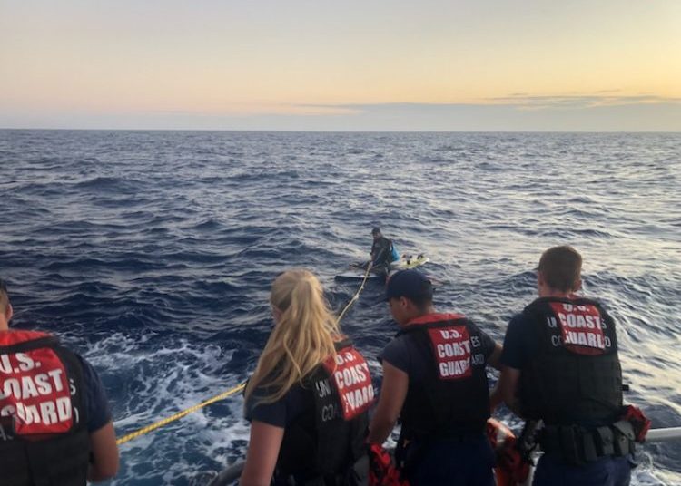 Last Wednesday, the Coast Guard rescued a Cuban diving coach in waters near the Keys who crossed the Straits of Florida on a windsurf board and wearing only a life jacket with a GPS and cell phones. Photo: Coast Guard.