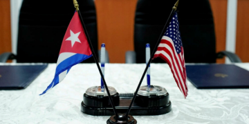 A view of the Cuban and United States flags taken before the signing of the agreements between the Port of Cleveland and Cuban maritime authorities in Havana on October 6, 2017. Alexandre Meneghini/Reuters