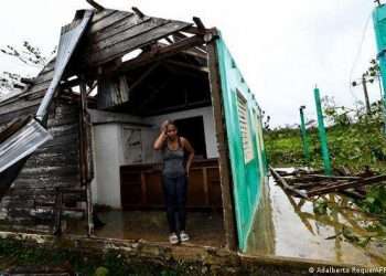 A woman in her house destroyed by Hurricane Ian in San Juan y Martinez, Pinar del Río. Photo: AFP/Getty Images.