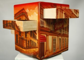 “Old Havana,” 2011. Cedar humidor with capacity for 100 cigars, according to vitola. Acrylic and varnish on wood, 37 x 30 x 30 cm. Facade of the Partagás factory building and images of Old Havana. It has four drawers, one per side.