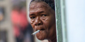 Smoking in Cuba. Cuban women smoke in a Havana doorway
