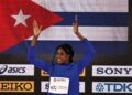 Leyanis Pérez on the awards podium at the World Indoor Athletics Championships in Nanjing, China. Photo: Andrés Martínez Casares/EFE/EPA.