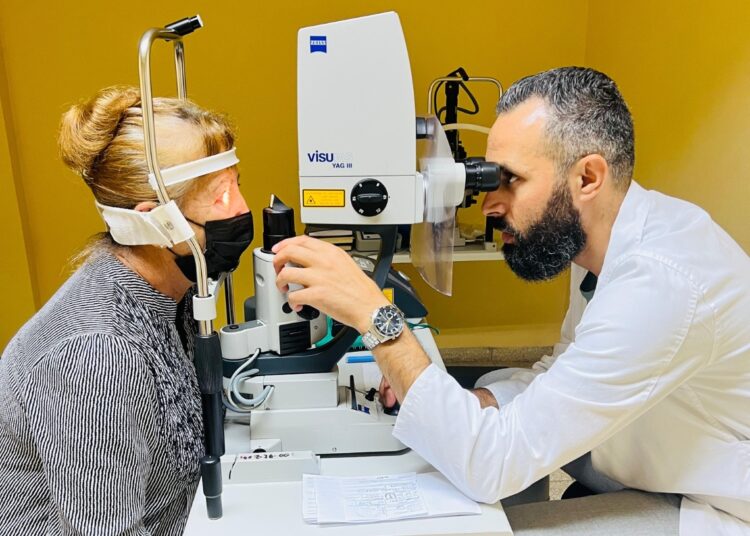 Dr. Tareq Zaid with a patient. Photo: Courtesy of the interviewee.