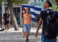 Passersby on a Havana street. Photo: EFE/Ernesto Mastrascusa.