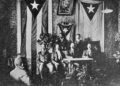 Photo taken on October 10, 1892, in which Martí appears presiding over the Kingston Council. The Cuban flag can be seen unfurled to his right and the Puerto Rican flag to his left.