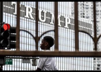 Black child in front of Trump Tower