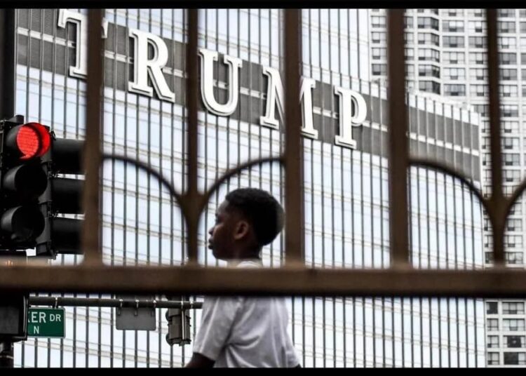 Black child in front of Trump Tower