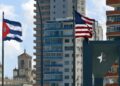 U.S. and Cuban flags flying in front of the U.S. Embassy in Havana