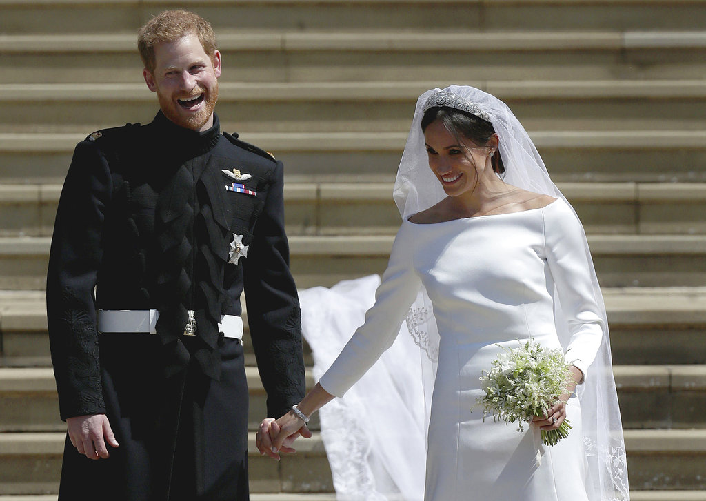 El príncipe Enrique de Inglaterra y Meghan Markle salen de la Capilla de San Jorge tras la ceremonia de su boda, en el Castillo de Windsor, el sábado 19 de mayo del 2018. (Andrew Matthews/pool photo via AP)