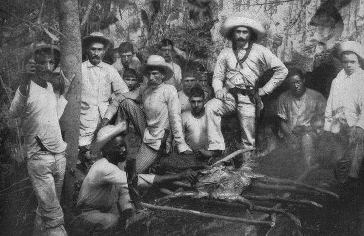 Mambises preparan un lechón asado. Cuba, 1896. Foto tomada de Memorandum Vitae.