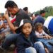 Migrantes centroamericanos que forman parte de la caravana que espera llegar a la frontera con Estados Unidos, en un remolque Donají, en el estado de Oaxaca, México, el viernes 2 de noviembre de 2018. Foto: Marco Ugarte / AP.