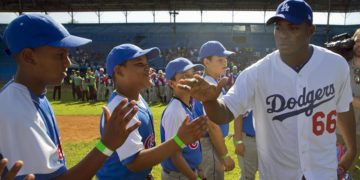"Saber que futuros peloteros cubanos no tendrán que pasar por lo que pasamos, me hace feliz", dijo Yasiel Puig tras la firma del acuerdo entre la Federación Cubana y MLB. Foto: Ramón Espinoza/AP