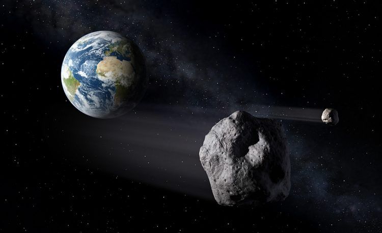 Recreación digital del paso de dos asteroides junto a la Tierra. Imagen: esmateria.com