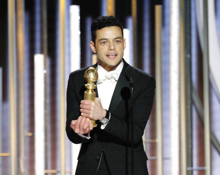 Rami Malek recibe el Globo de Oro al mejor actor en una película de drama por su trabajo en "Bohemian Rhapsody", el domingo 6 de enero del 2019 en Beverly Hills, California. Foto: Paul Drinkwater / NBC vía AP.