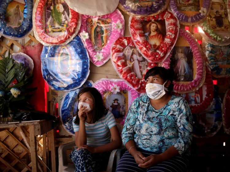 Una vendedora popular y su hija en Ciudad México. Foto: Business Insider.