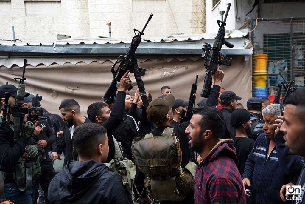 Balata Brigade militiamen fire into the air at militiaman's funeral in Nablus West Bank.  Photo: Alejandro Ernesto.