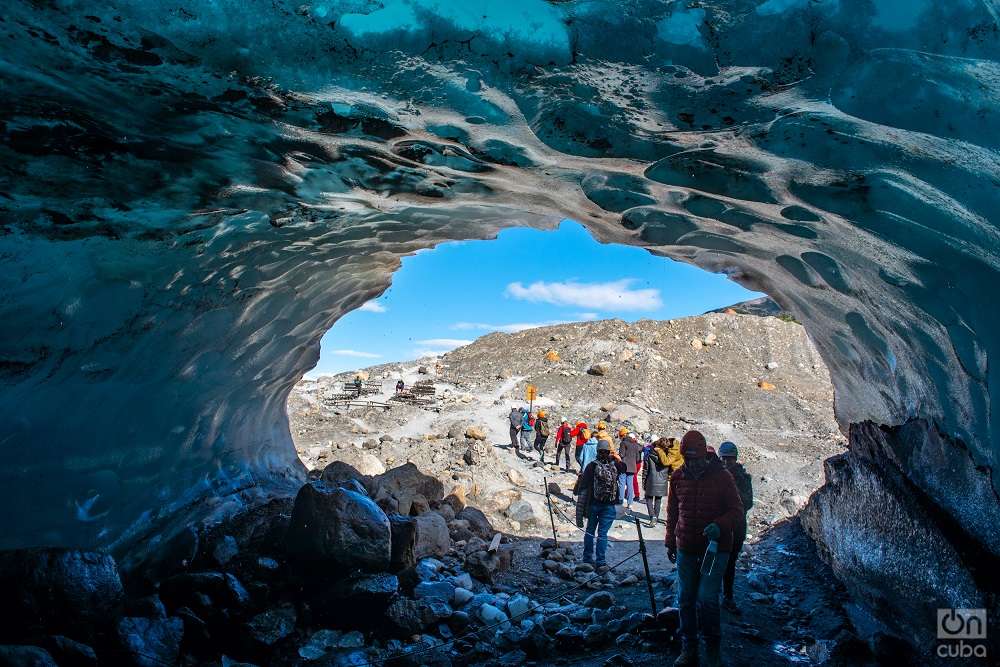 A cave with walls and a natural roof of ice between the glacier and the mountain.  Photo: Kaloian.