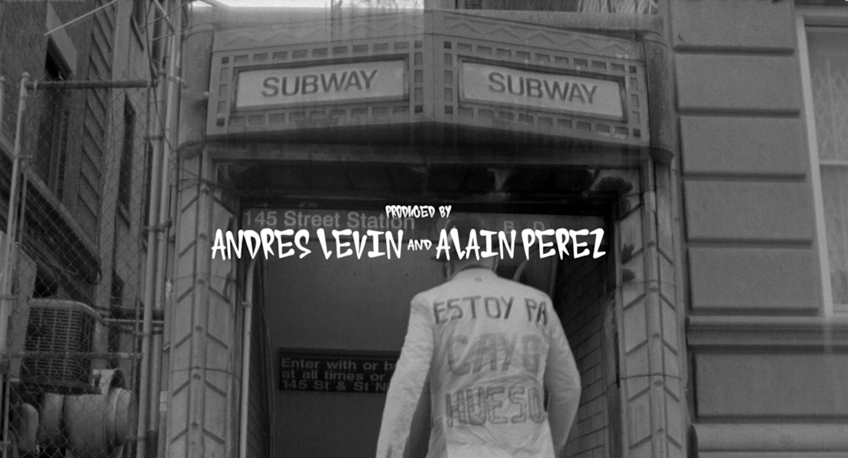 Still from the “Manteca 2.0” video clip. Andrés Levin enters the New York Subway. His jacket says “Estoy pa Cayo Hueso.”