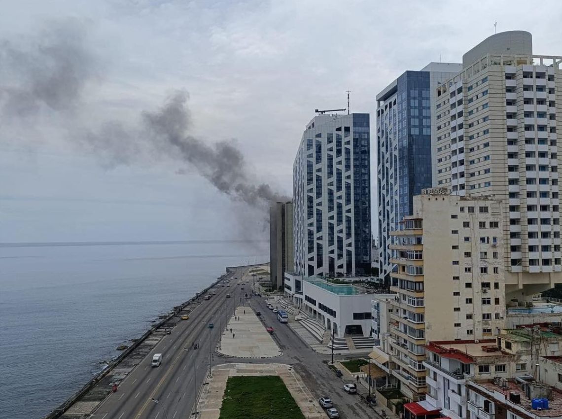 Firefighters control the fire in the Giron del Vedado building