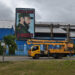 Un camión de la empresa eléctrica pasa cerca de un cartel con la imagen del fallecido expresidente Fidel Castro, en La Habana. Foto: Otmaro Rodríguez.