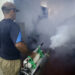 Un hombre fumigando una casa en La Habana. Foto: Ernesto Mastrascusa/ EFE.